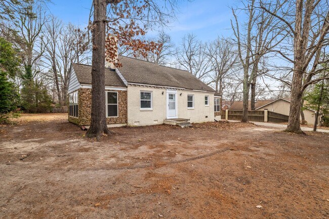 Building Photo - Brick home, Two Story, Hardwoods, DR, 2 Sun Rooms, FP, Carport!.
