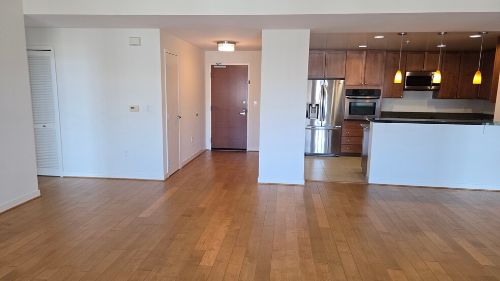 Living room and open concept kitchen - 175 W Saint James St