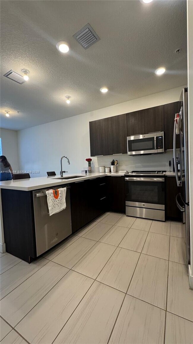 Building Photo - 6416 NW 102nd Ct