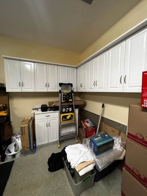 Garage with built in storage cabinets - 8325 Carnoustie Ave