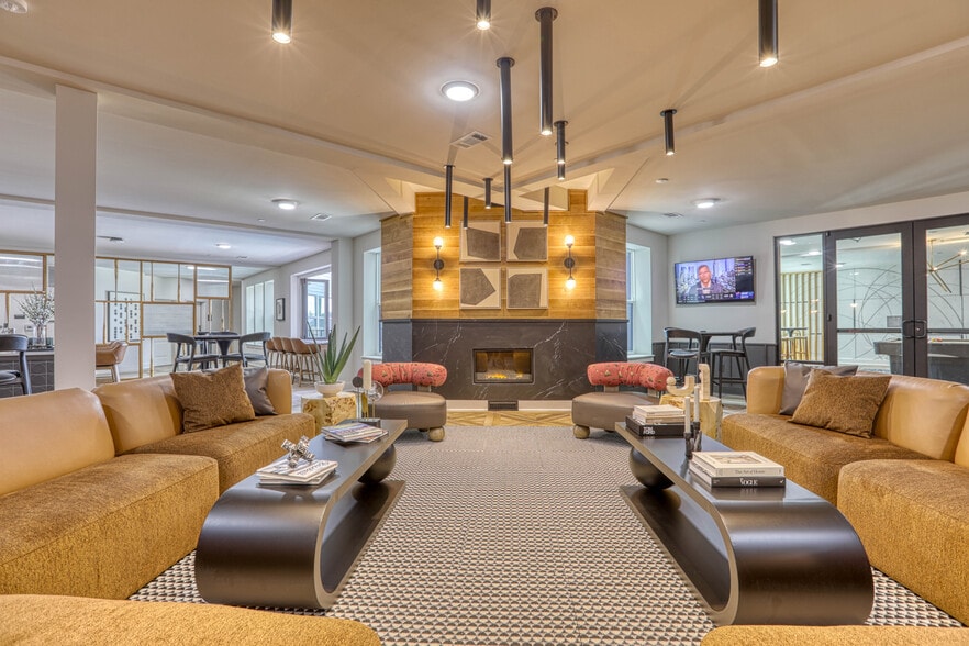 Homerun hangout with fireplace, custom bat wall, seating - Yardley Flats Apartments