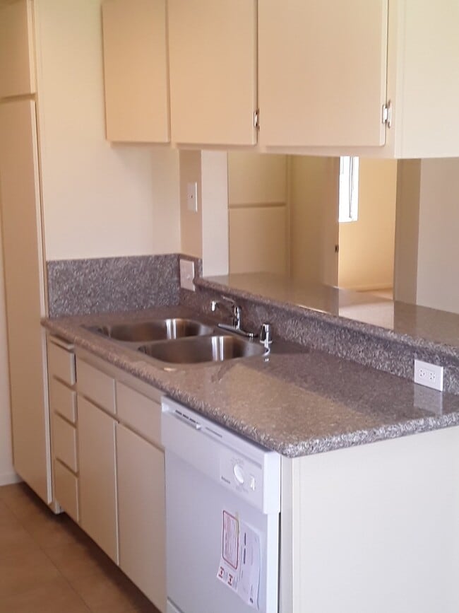 Kitchen has new granite counter tops, new sink, new faucet, new cabinet doors - 21911 Claretta Ave