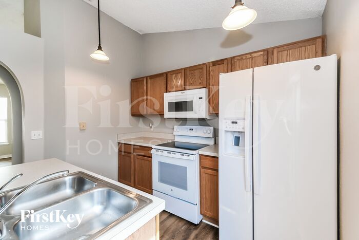 Building Photo - 6565 Gentle Oaks Dr