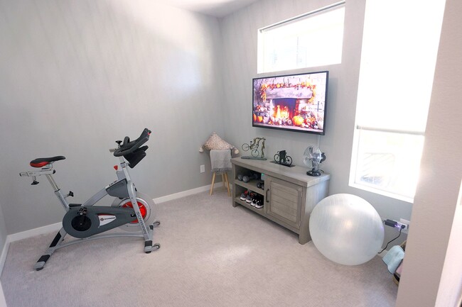 Den on lower level, currently used as a workout room. - 15637 E Broncos Pl