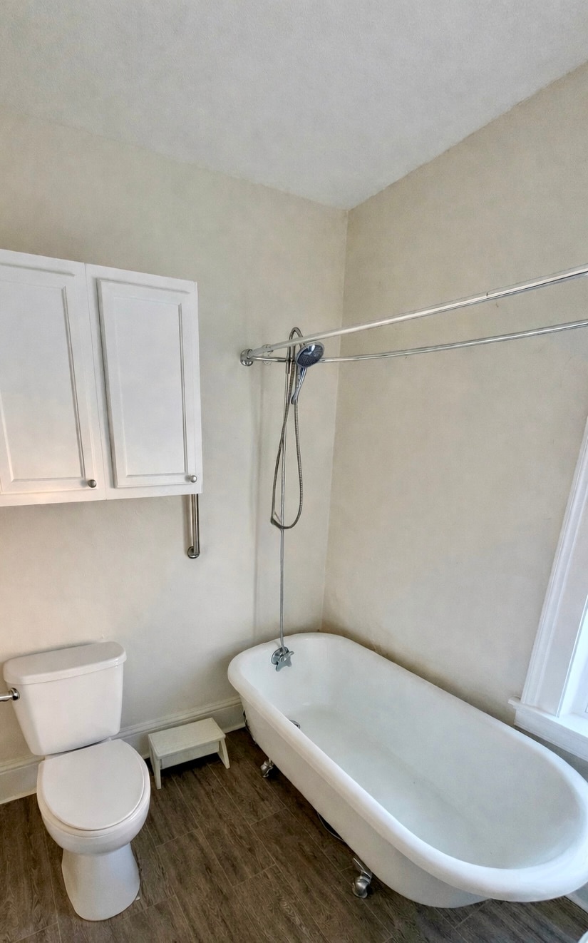 Bathroom with original call foot tub and shower - 52 Genesee St