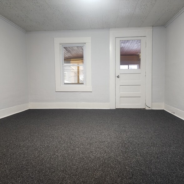 Front bedroom looking towards enclosed porch - 396 Norton St