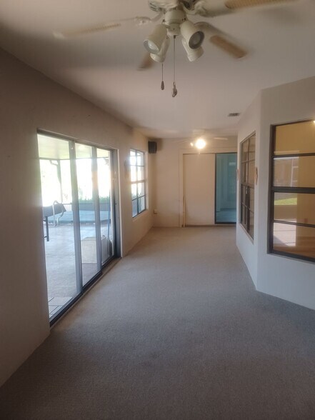 Building Photo - COMING SOON: Spacious Gulf Access 3 BR / 3 BA Home With a Large Screened Lanai for Entertaining &...