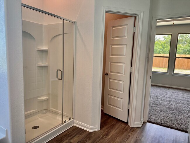 The primary bath also features a soaker tub, stand up shower and private water closet. - 730 Tejas Village Pky