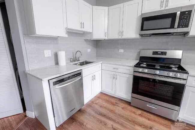 Building Photo - Modern 4BR Apartment with Hardwood Floors, Balcony & Central A/C