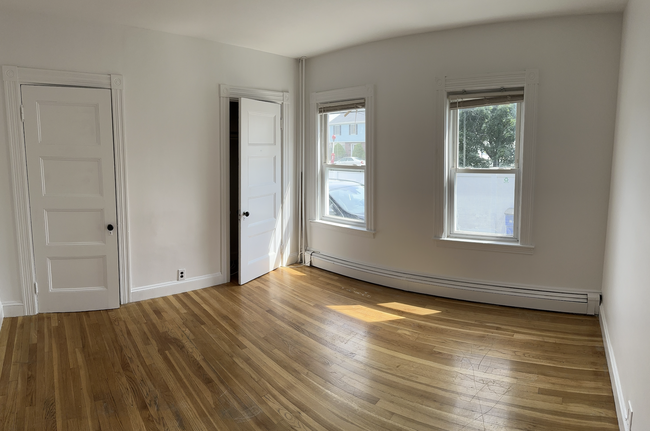 Sunny bedroom (2nd) with two closets and ample natural light. Queen/full. - 58 S Waverly St