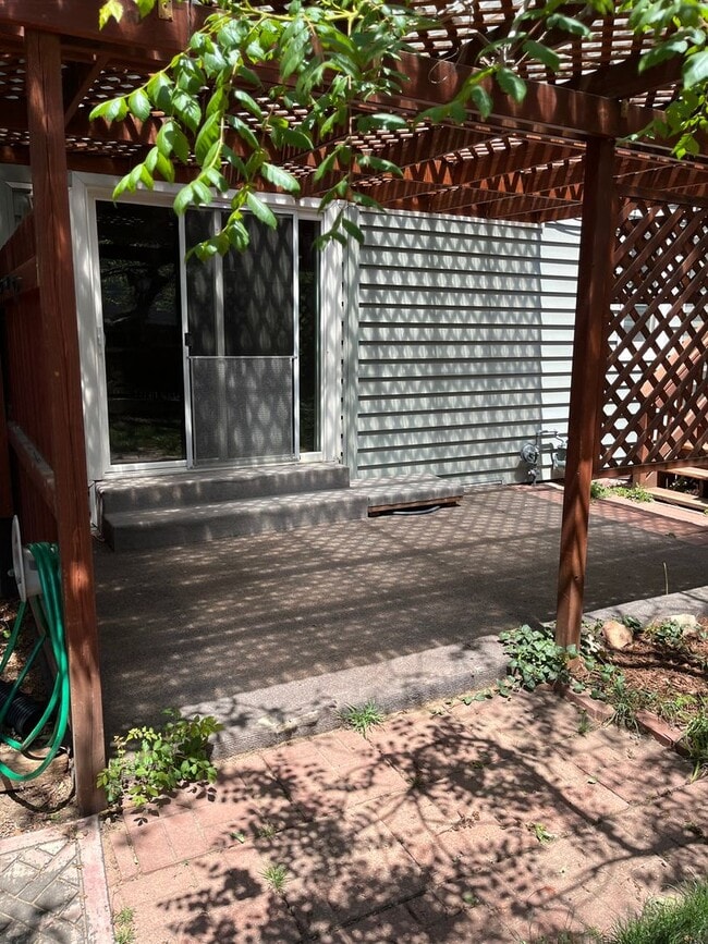 Building Photo - 4 Bedroom Gardener's Delight With Rooftop Patio, Privacy and Covered Parking