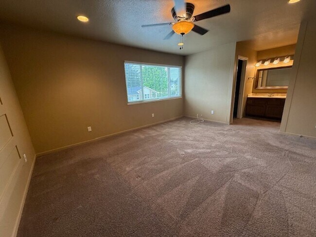 Building Photo - Private Redwood Setting | 4BR Home with Family Room, Bar & Garage Workspace - Available Now