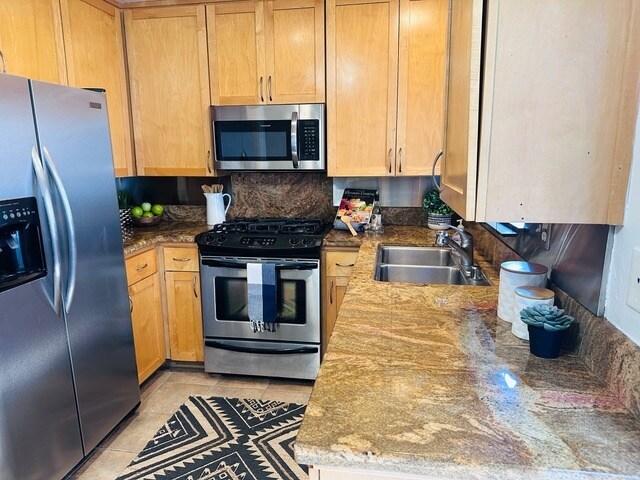 Kitchen includes fridge, oven, built-in microwave, dishwasher, and in unit washer and dryer - 2474 S Centinela Ave