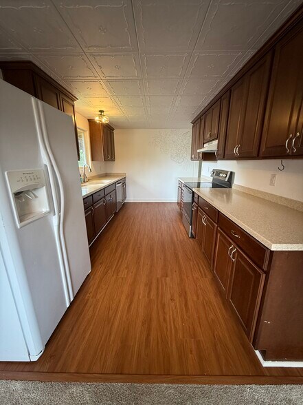 Kitchen from dining room (upstairs) - 13016 16th St NE