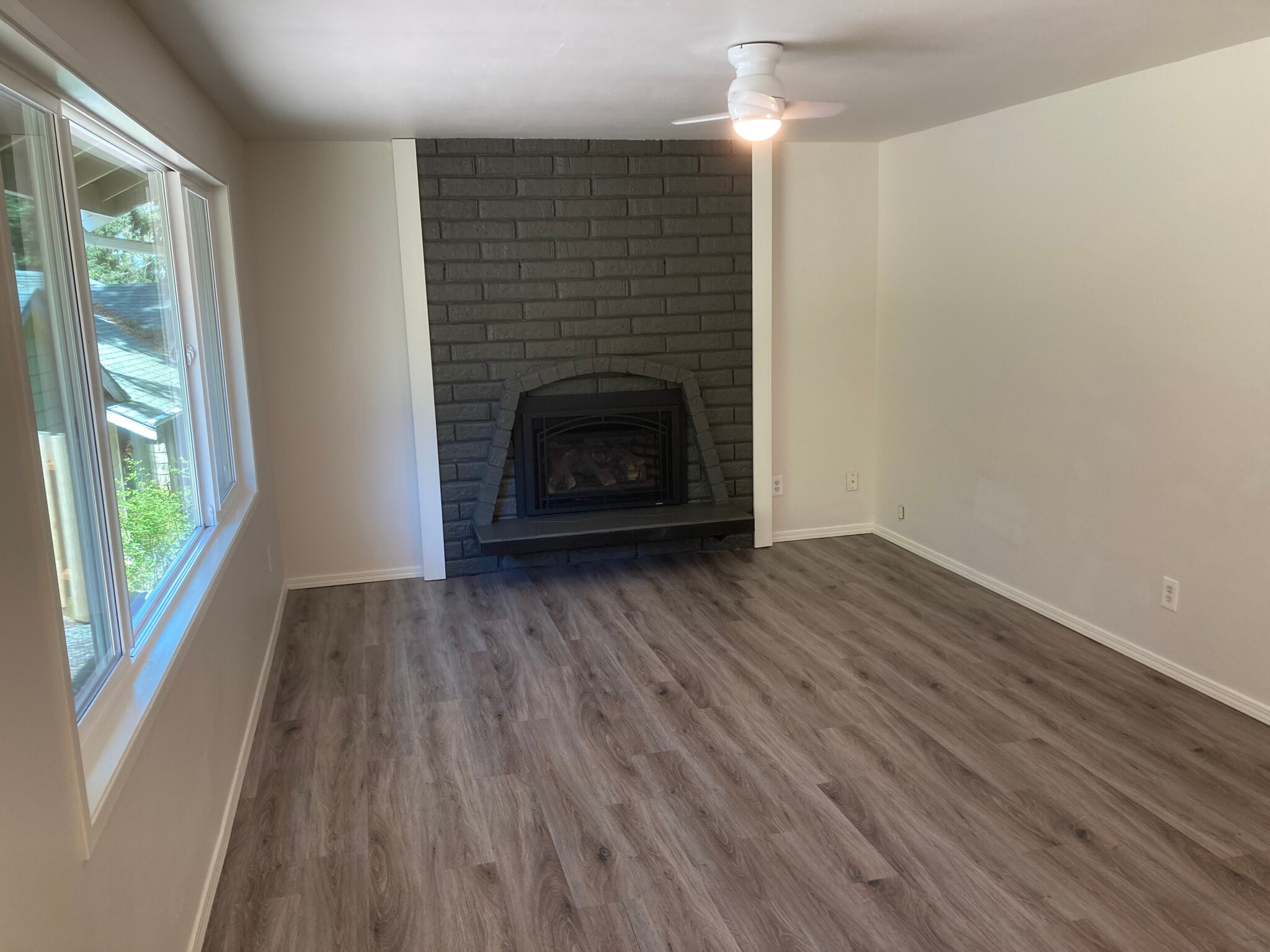 Family room with gas fireplace - 2549 Yew Street Rd