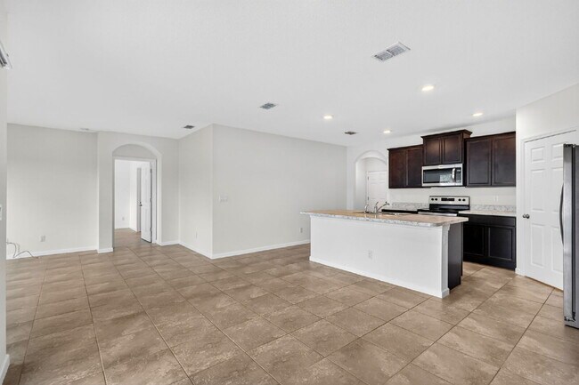 Building Photo - Renovated 4 Beds 2 Baths Single Family on Over a QTR Acre lot | Huge Yard