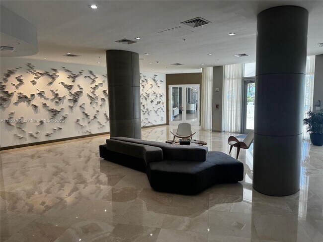 Building Photo - 10275 Collins Ave