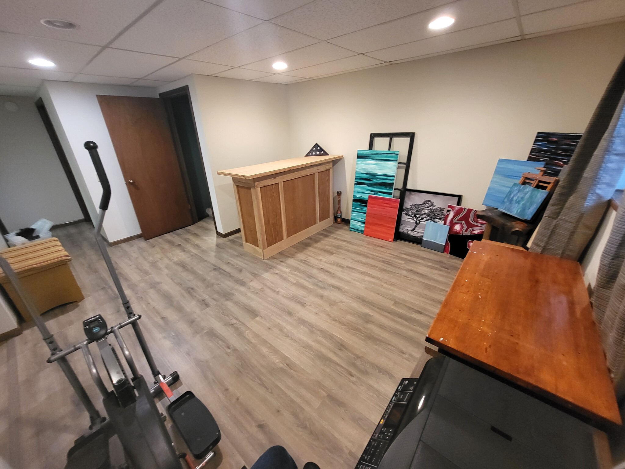 Lower level Rec room with LVP flooring throughout - 8460 Red Oak Dr