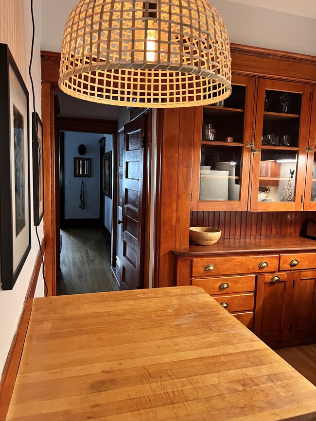 Wells appointed kitchen with butcher block island. - 2424 Stevens Ave