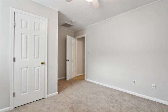 The home offers three spacious bedrooms! - 1644 Skiffes Creek Cir