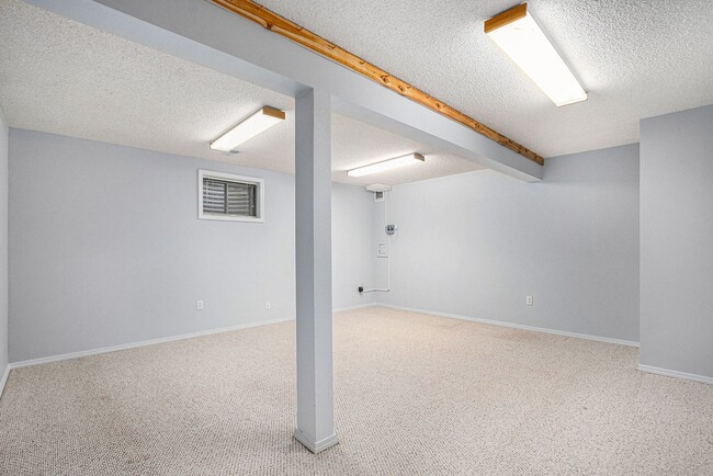 Building Photo - Spacious Home with Fireplace and Well Main...