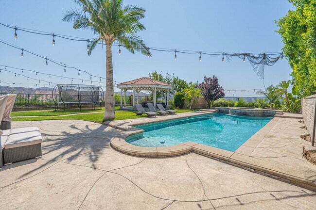 Building Photo - Spectacular 5-Bedroom Home with Pool, RV P...