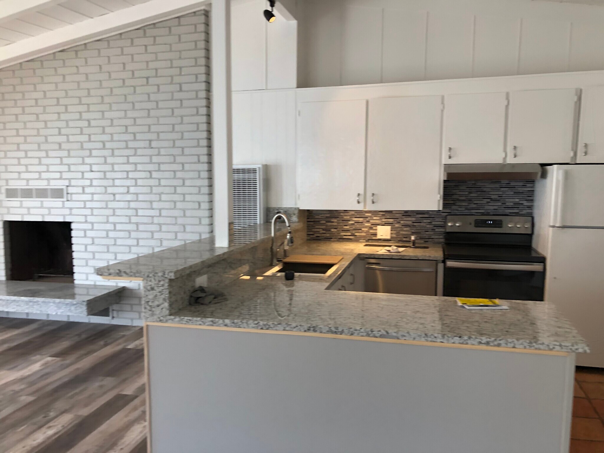 kitchen with view of fireplace - 25410 Malibu Rd