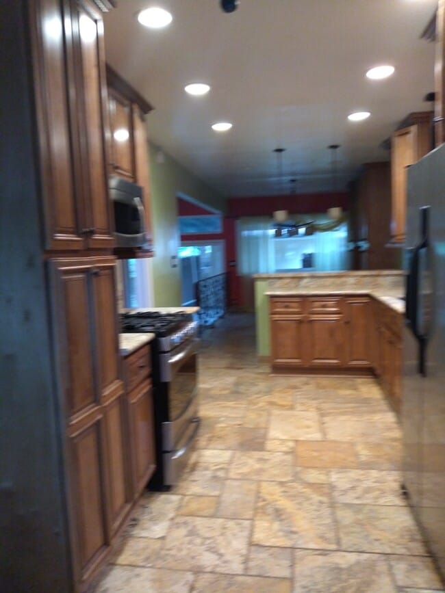 Kitchen with stainless steel convectionoven - 6601 Louise Ave