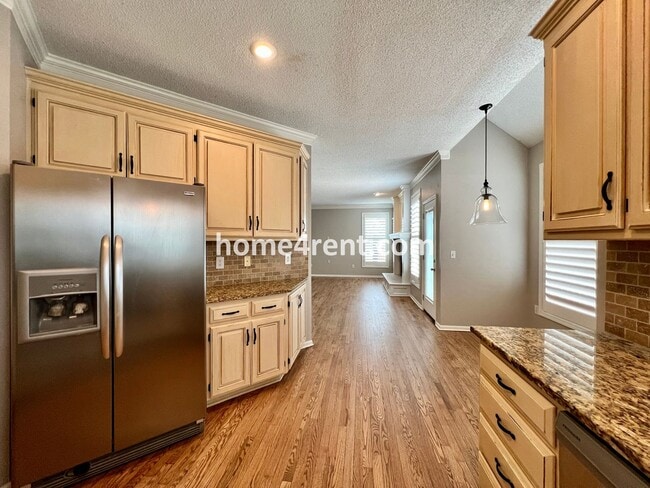 Building Photo - Updated Kitchen, Large Two Tiered Deck, Finished Basement in Blue Valley Schools!