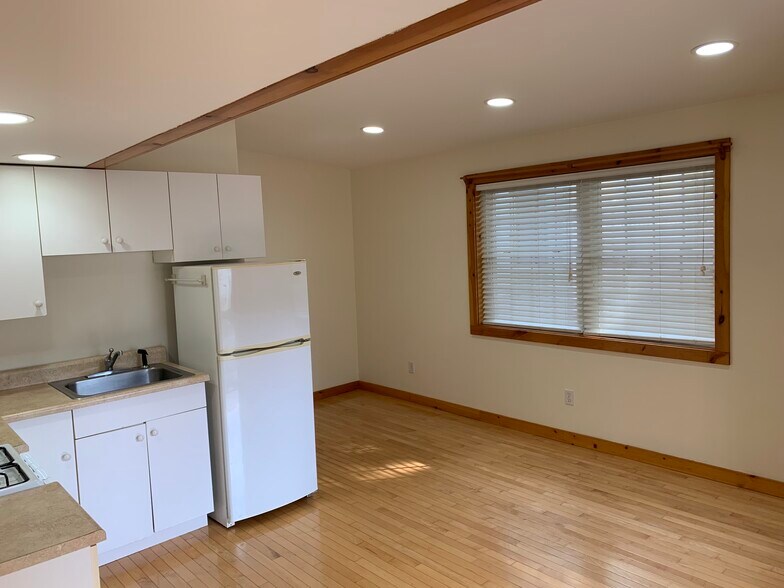 Looking from bedroom doorway into open-concept kitchen/living room area - 37 Court St