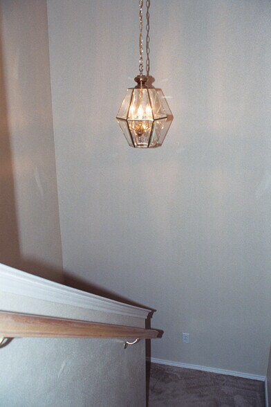 Stairway Landing with chandelier - 7556 Arbor Hill Dr