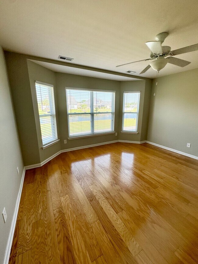 Building Photo - Like New 3 Bedroom & 2 Bath pond front home in Hillsborough! Enjoy the Community Pool, Playground...