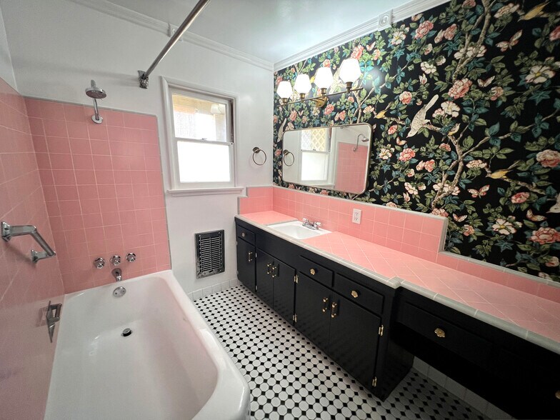 Bathroom with original 1950s pink tile. - 1327 N Central Ave