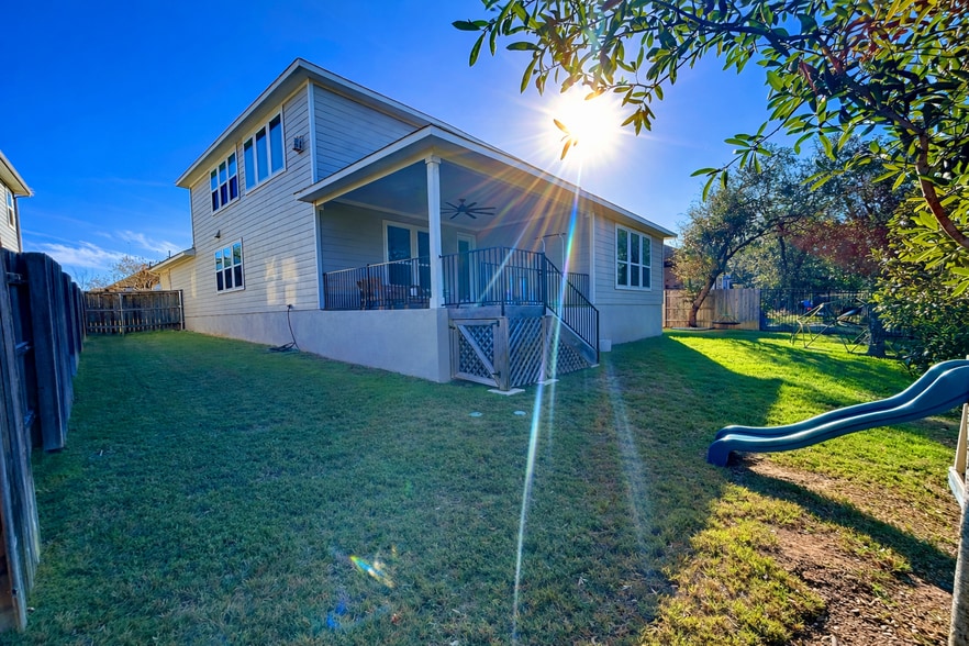 Spacious backyard with large side yards, offering plenty of room to play and relax. - 517 Moonlit Stream Pass