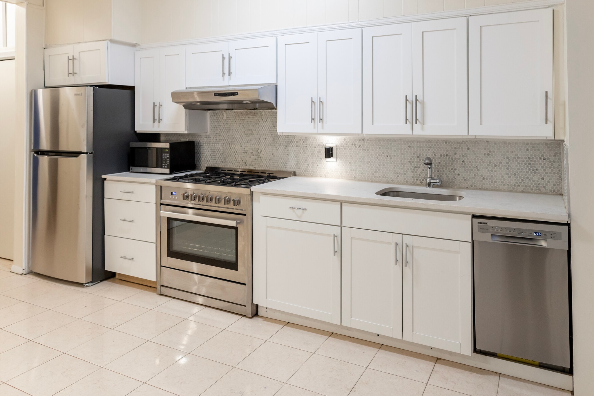 Upgraded kitchen includes new stove, counterstop, cabinets and backsplash. - 61 Duffield St