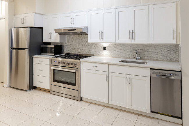 Upgraded kitchen includes new stove, counterstop, cabinets and backsplash. - 61 Duffield St