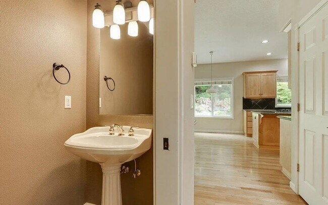 Building Photo - Spacious Four-Bedroom Home with Gourmet Kitchen, Multiple Living Areas, Loft, and Beautifully Lan...