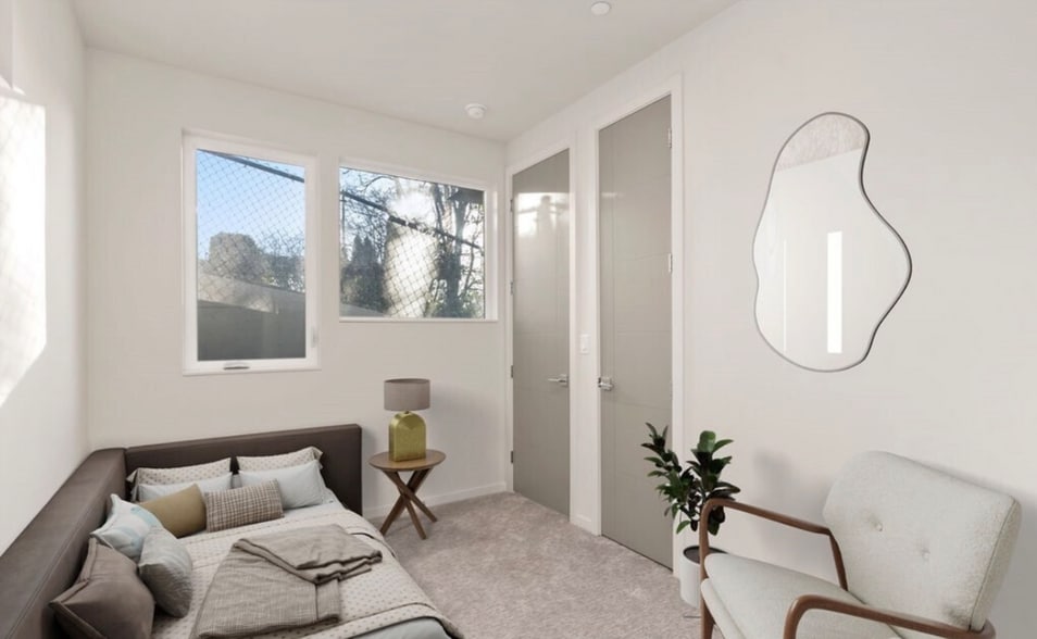 Compact bedroom with good natural light and a clean, efficient layout. - 2921A Franklin Ave E