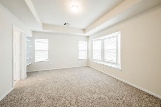 Building Photo - Beautiful stone front 4 bedroom, 3 bath home has bay windows in breakfast nook & master. It is on...