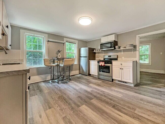 Building Photo - Seeking a roommate for a 2 bdr, 2 bath lower level condo with a porch and private yard, 1.5 miles...