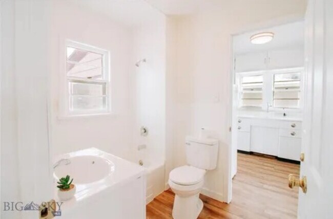 Bathroom is accessible from the kitchen as well as bedroom - 2025 Grand Ave