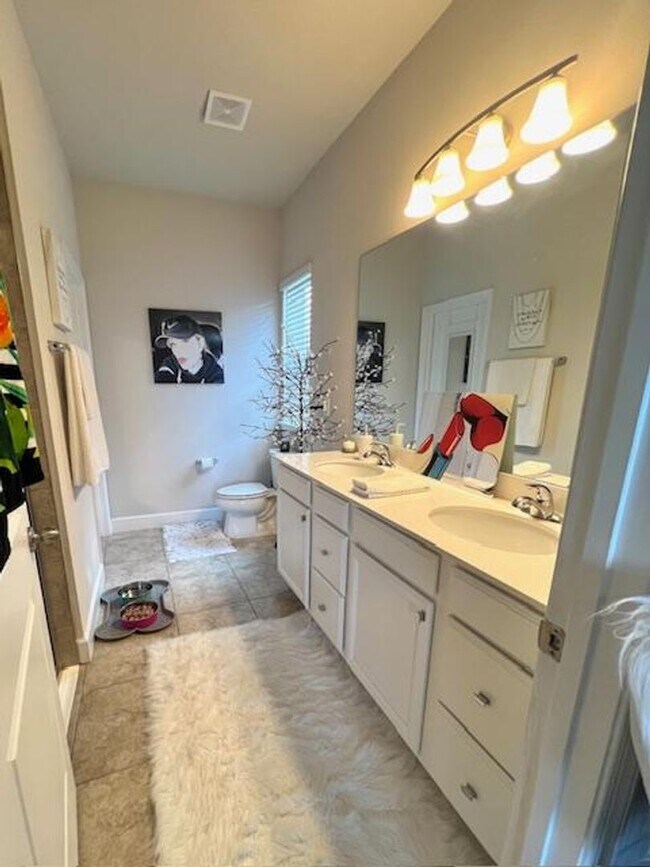 Building Photo - Open concept home offering four bedrooms, three baths, a two car garage and open lanai.