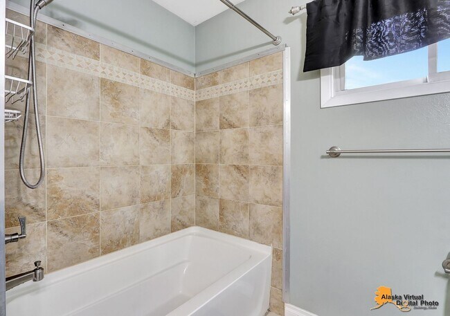 Building Photo - Eagle River Home w/ Fenced Yard, Sunroom, and Garage!