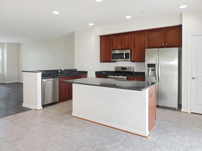 Building Photo - Pet Friendly 3 level End Unit Town Home wi...