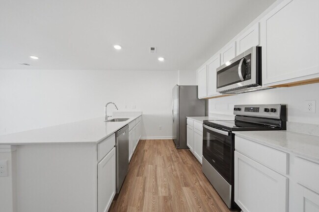 Building Photo - Modern Comfort in a Peaceful Newton Community This newly built 3-bed, 2.5-bath townhome blends mo...