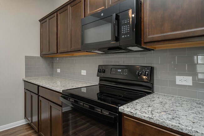 Building Photo - Live, love, and grow in this charming townhome!