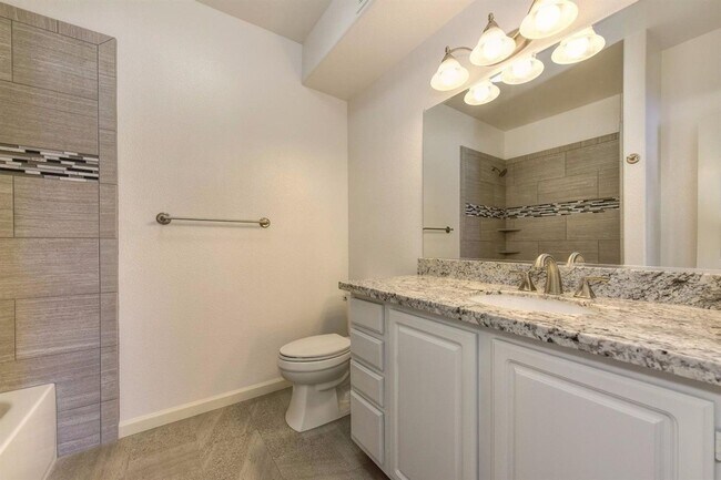 Building Photo - NICE 3 BEDROOM CONDO, 2 BATH, & 2 CAR GARA...