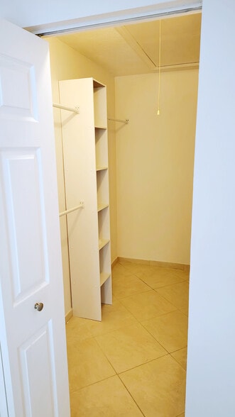 Walk-in-closet w/plenty of space, plus attic storage! - 1353 Pine Ridge Cir E