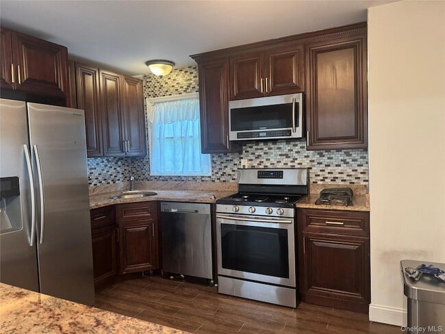Building Photo - 15649 76th St Unit 2