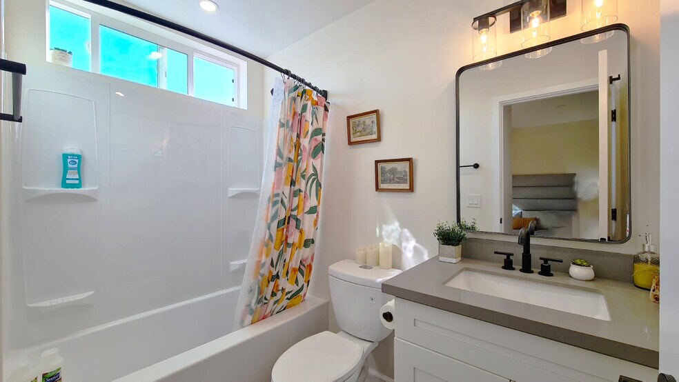 Enjoy a bright bathroom filled with natural light. - 721 E 22nd St